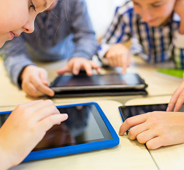 Students working on tablets